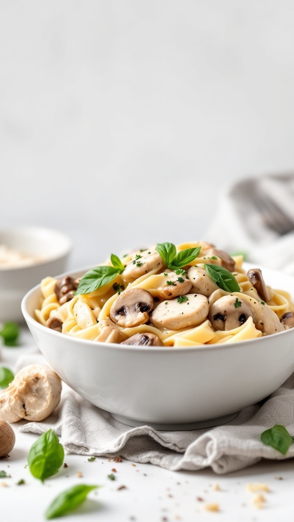 A delicious bowl of chicken and mushroom pasta topped with fresh herbs.